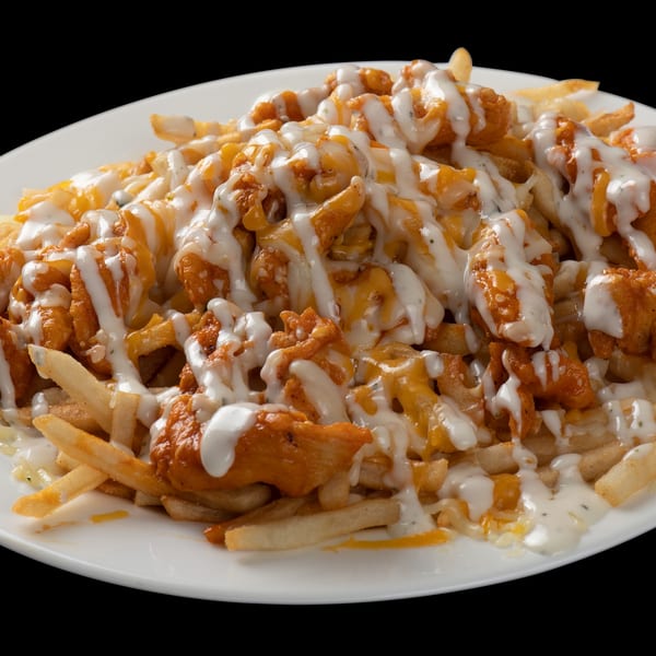 Town Pub's buffalo chicken fries, topped with melted cheese and a creamy white sauce.