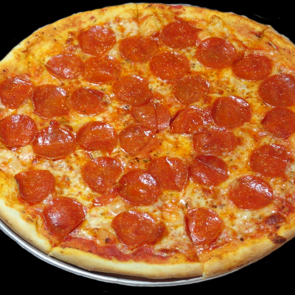 A whole pepperoni pizza from Town Pub, with melted cheese and a golden crust.